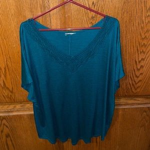 Teal blue top with lace at neckline
